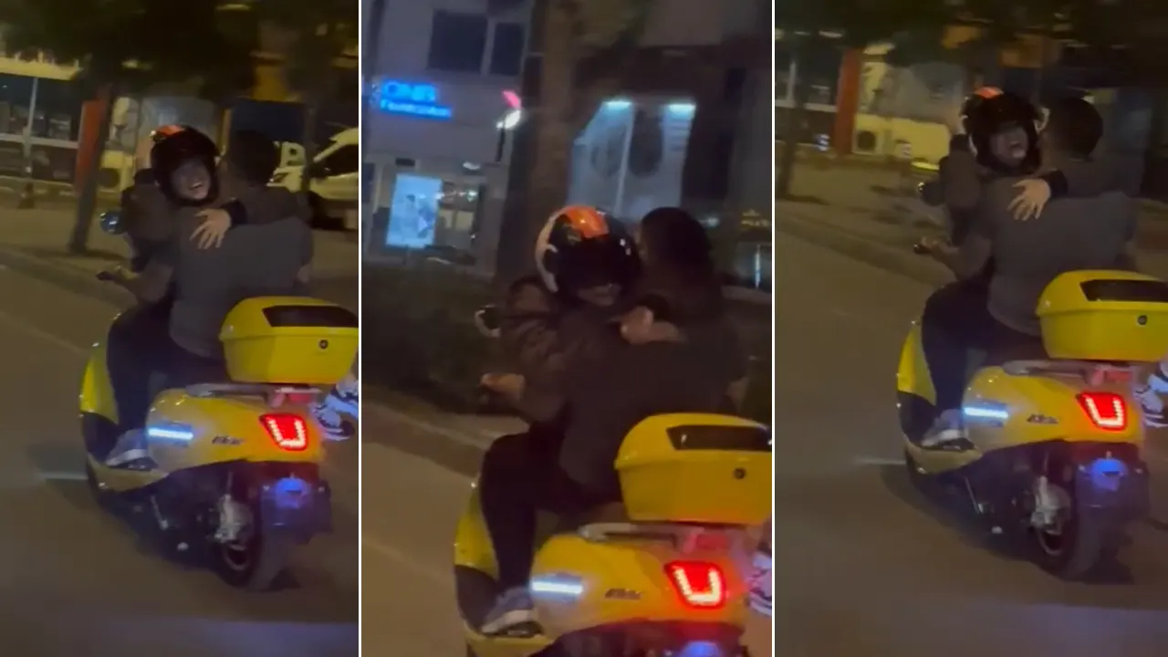 Tehlikeye aldırış etmediler: Motosiklette kız arkadaşını kucağında taşıdı