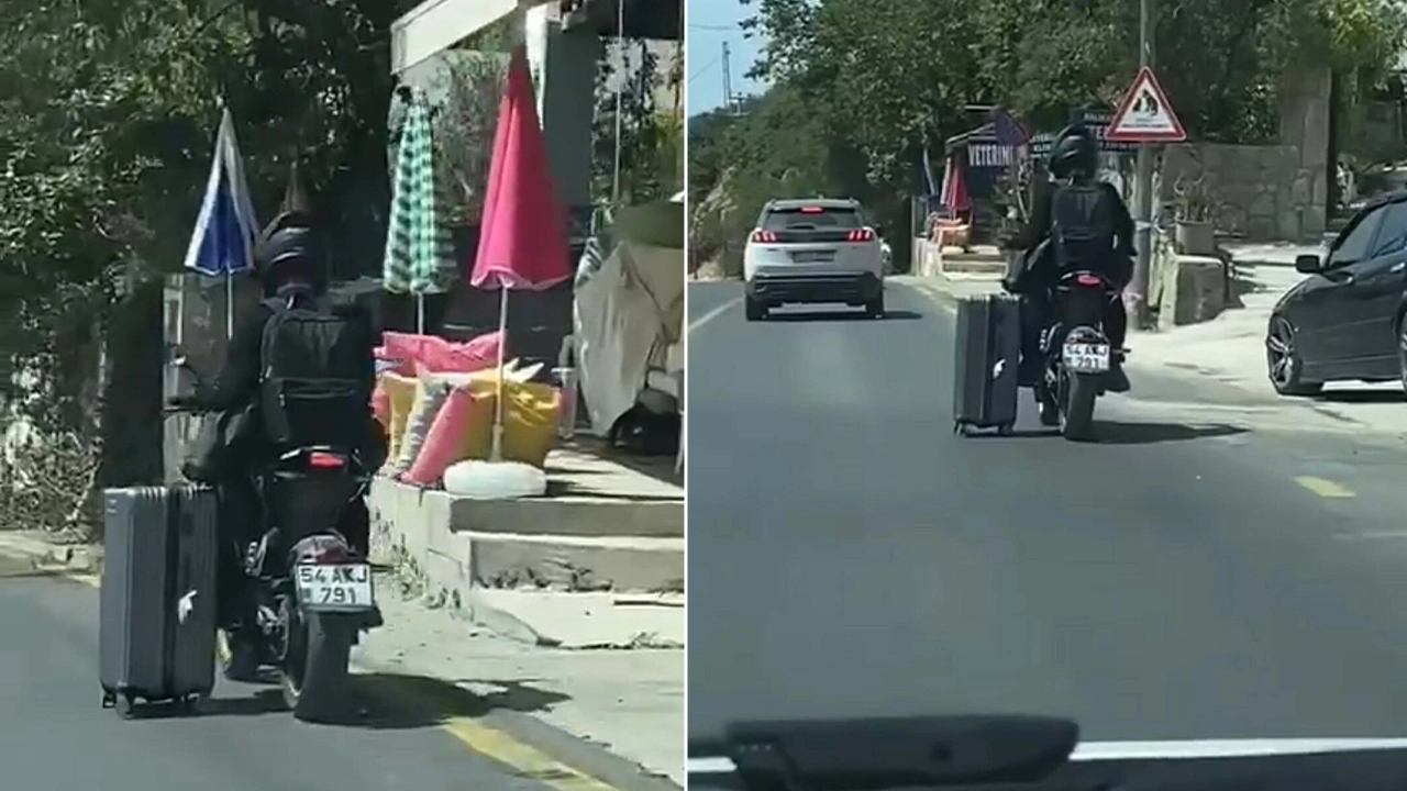 Trafikte tehlikeli anlar: Motosiklet sürücüsü valiziyle yolculuk yaptı