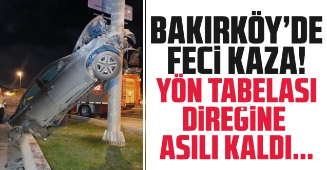 Fatih Günay otomobili ile Bakırköy'de yön tabelası direğine asılı kaldı